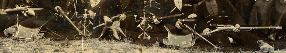 "Samples of products" of the Maykop craft school in the 1910 photograph: saddle trees, candlesticks, rifles, a kinjal