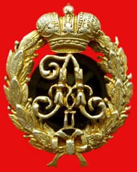 Gilt badge with imperial cypher (per Commons, a Convoy badge)