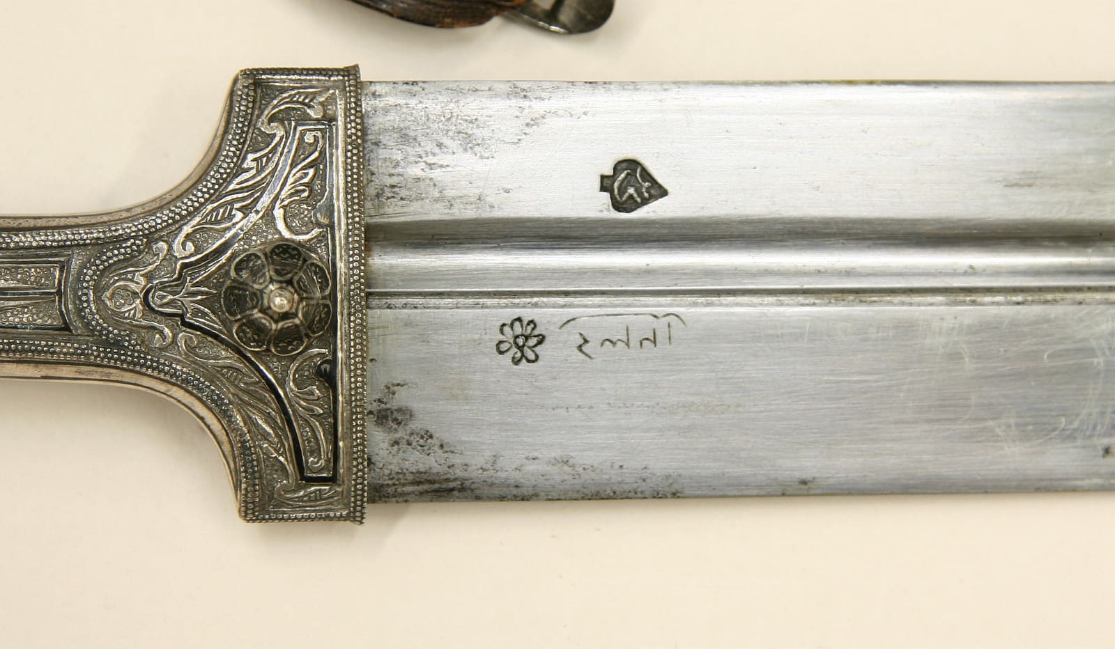 The same kinjal: maker's mark on the blade